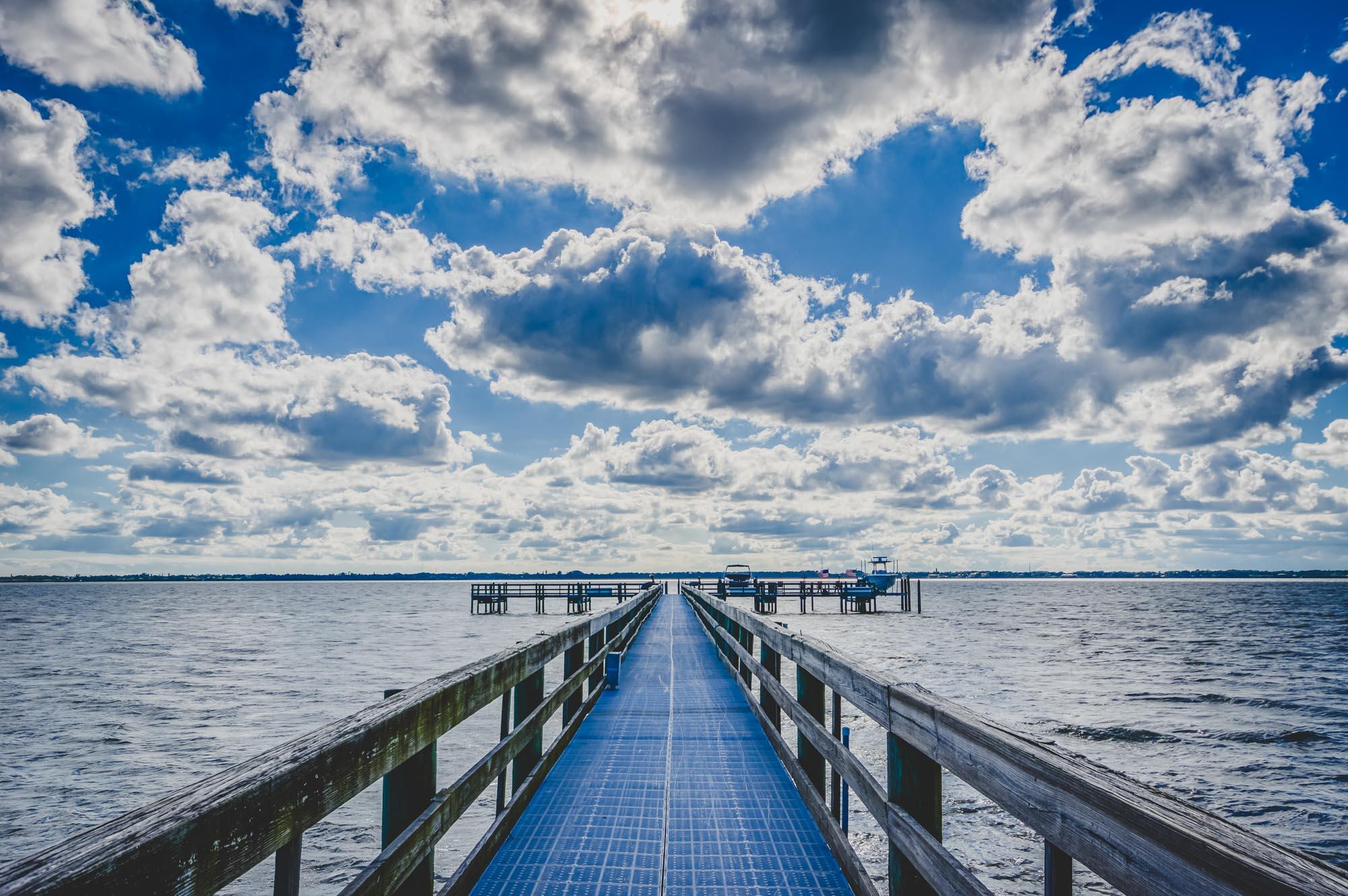 7683 Pelican Pointe Drive Jensen Beach, FL 34957 - Photo 37 of 40 a view of a balcony with wooden bridge