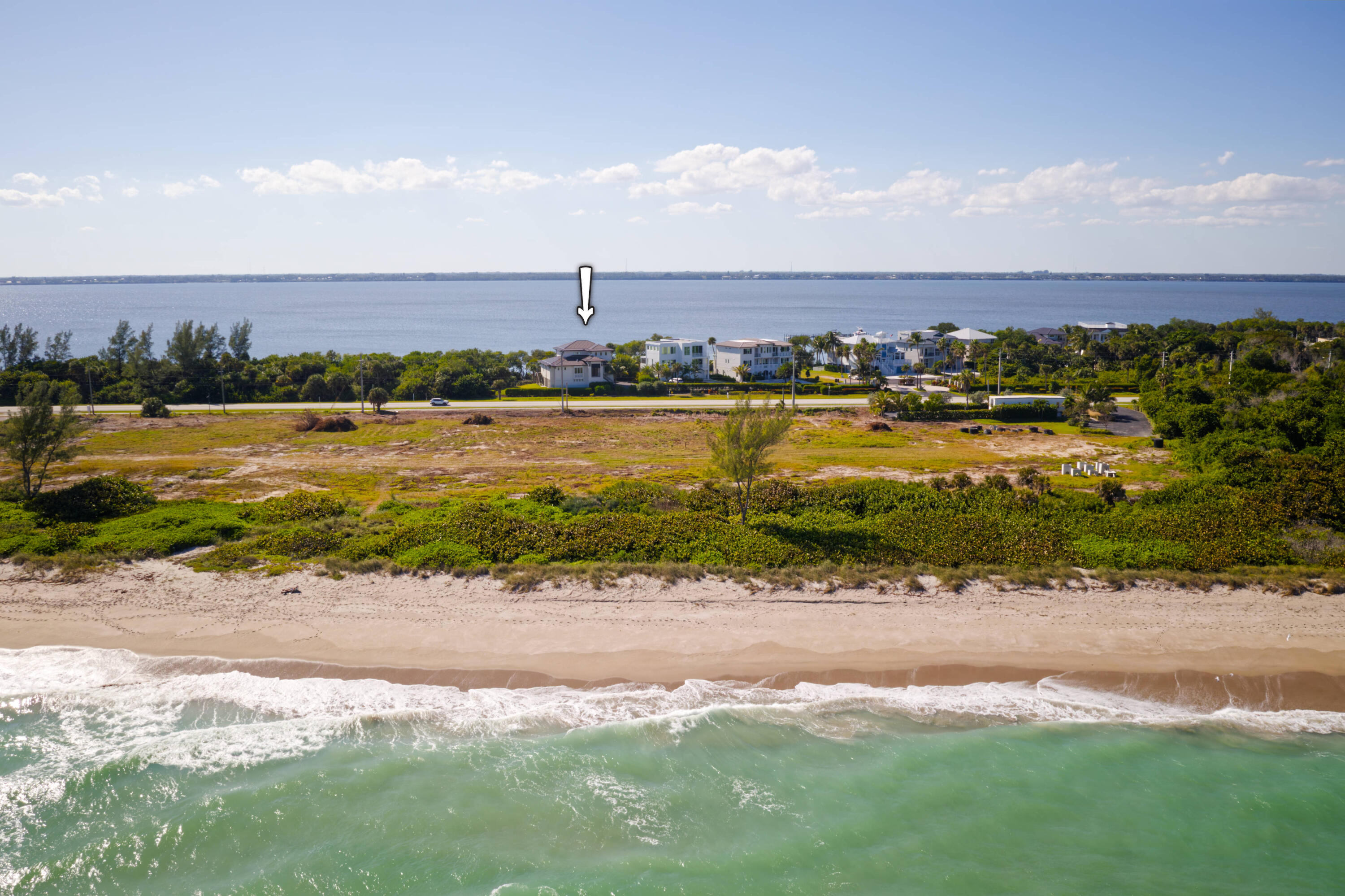 7683 Pelican Pointe Drive Jensen Beach, FL 34957 - Photo 40 of 40 an aerial view of beach and residential houses with outdoor space