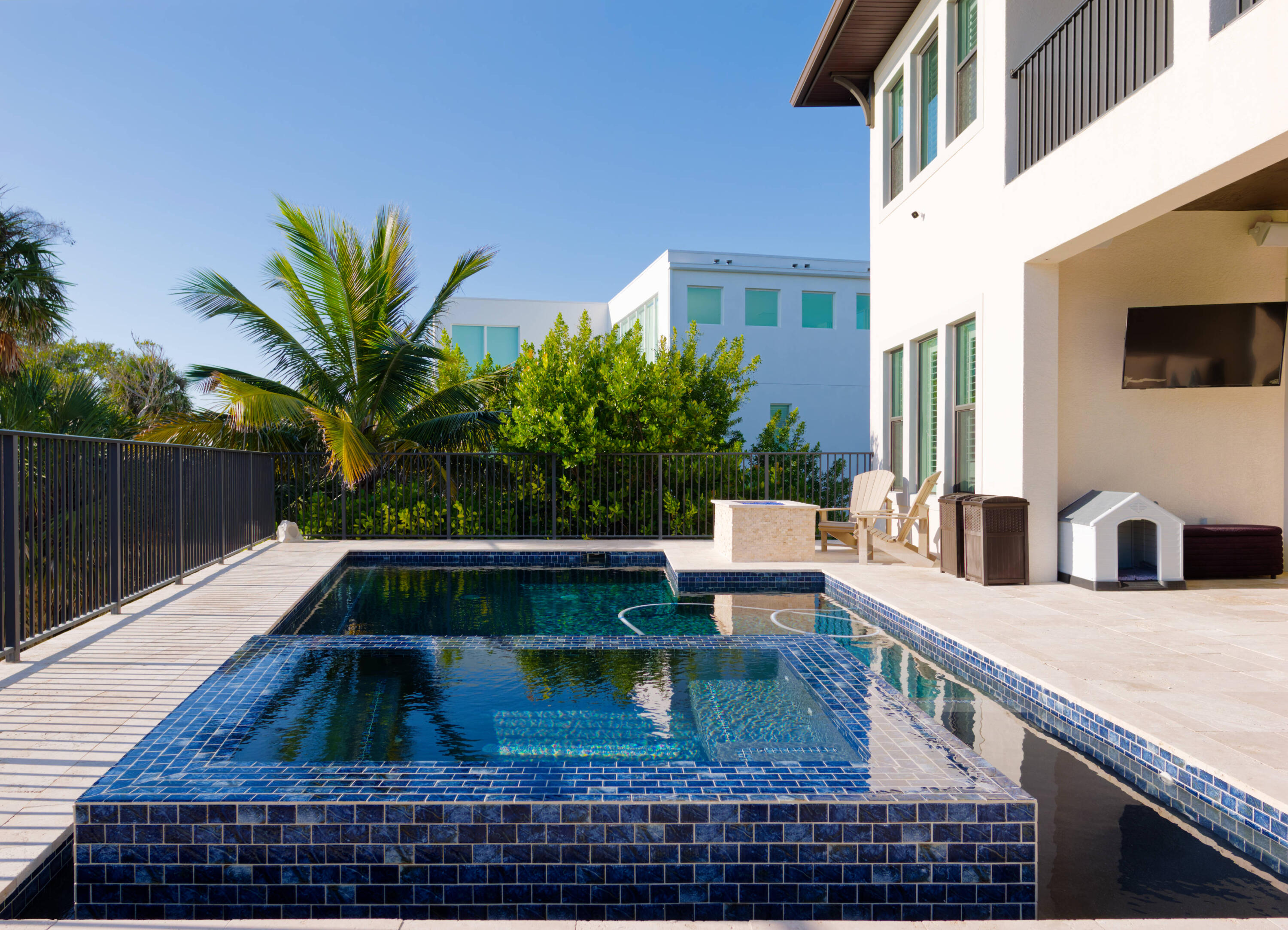 7683 Pelican Pointe Drive Jensen Beach, FL 34957 - Photo 7 of 40 a view of outdoor kitchen with seating area
