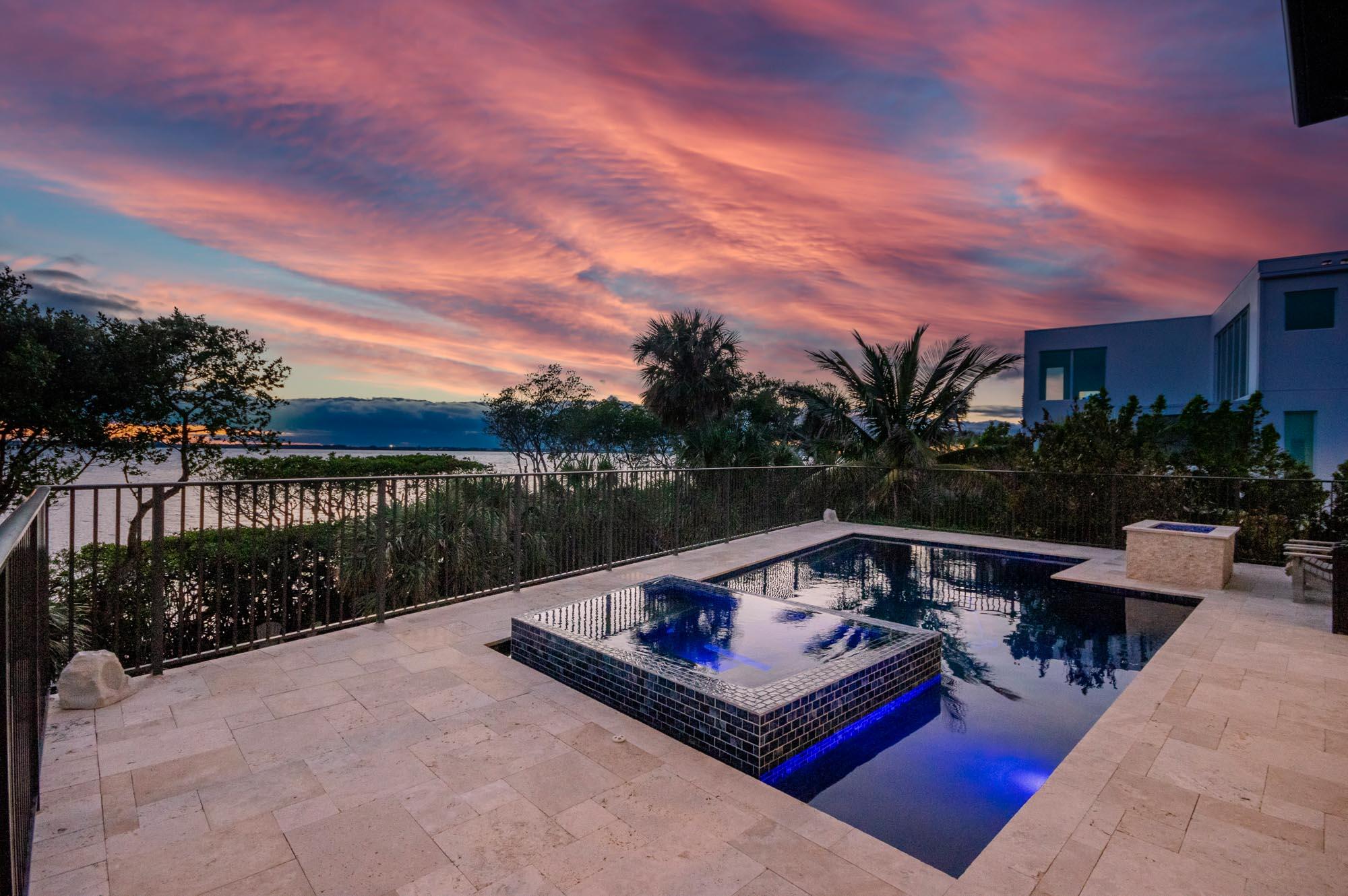 7683 Pelican Pointe Drive Jensen Beach, FL 34957 - Photo 8 of 40 a view of a terrace with couches and wooden fence