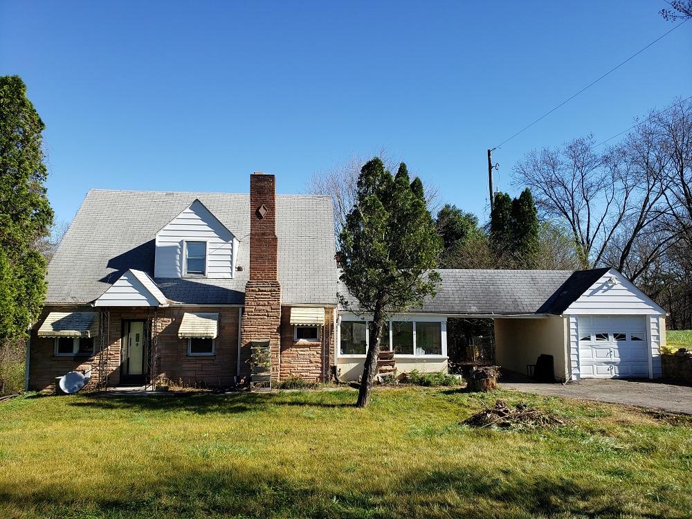 3400 Jae Valley Road Roanoke, VA 24014 - Photo 1 of 15 a front view of a house with a garden and trees