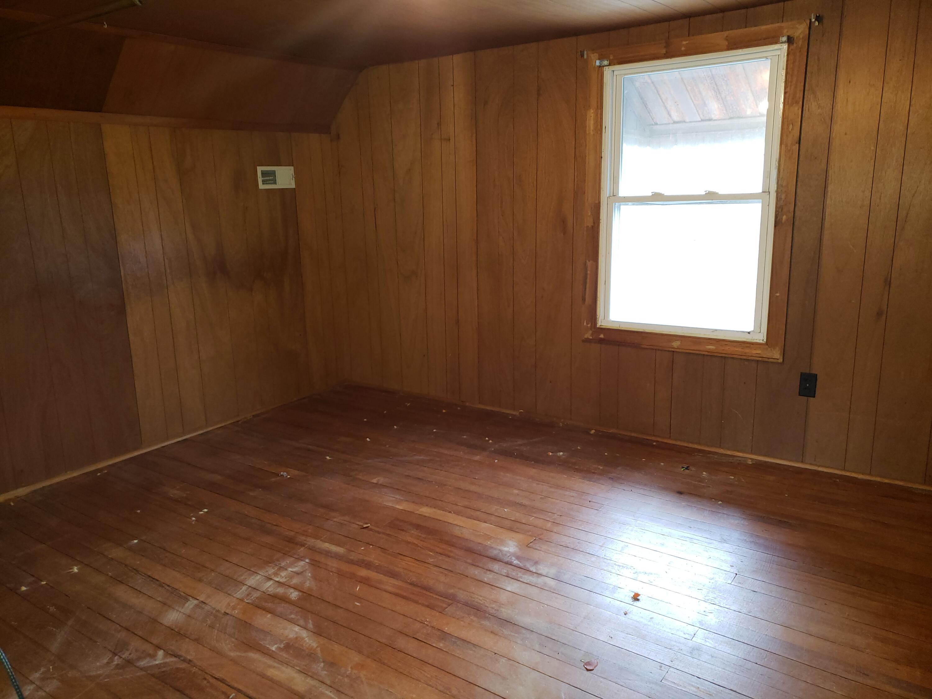 3400 Jae Valley Road Roanoke, VA 24014 - Photo 13 of 15 an empty room with wooden floor and windows