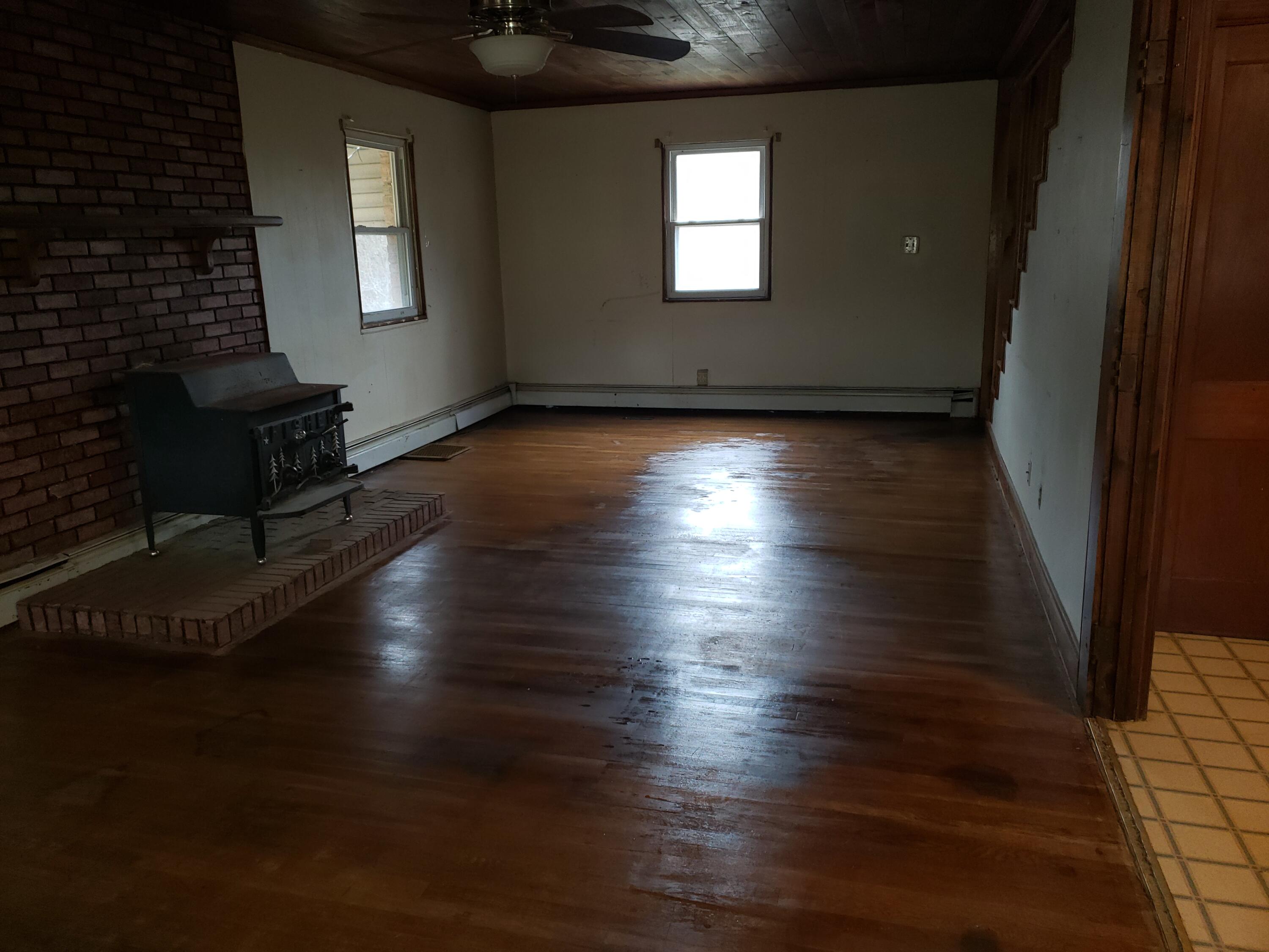 3400 Jae Valley Road Roanoke, VA 24014 - Photo 7 of 15 an empty room with wooden floor and windows