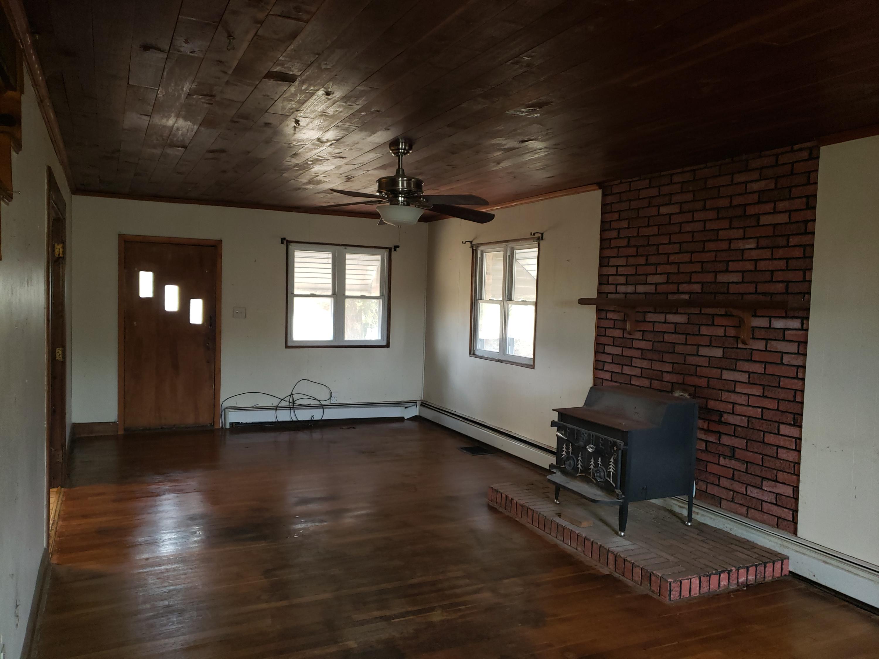3400 Jae Valley Road Roanoke, VA 24014 - Photo 8 of 15 a view of an empty room with wooden floor and a window