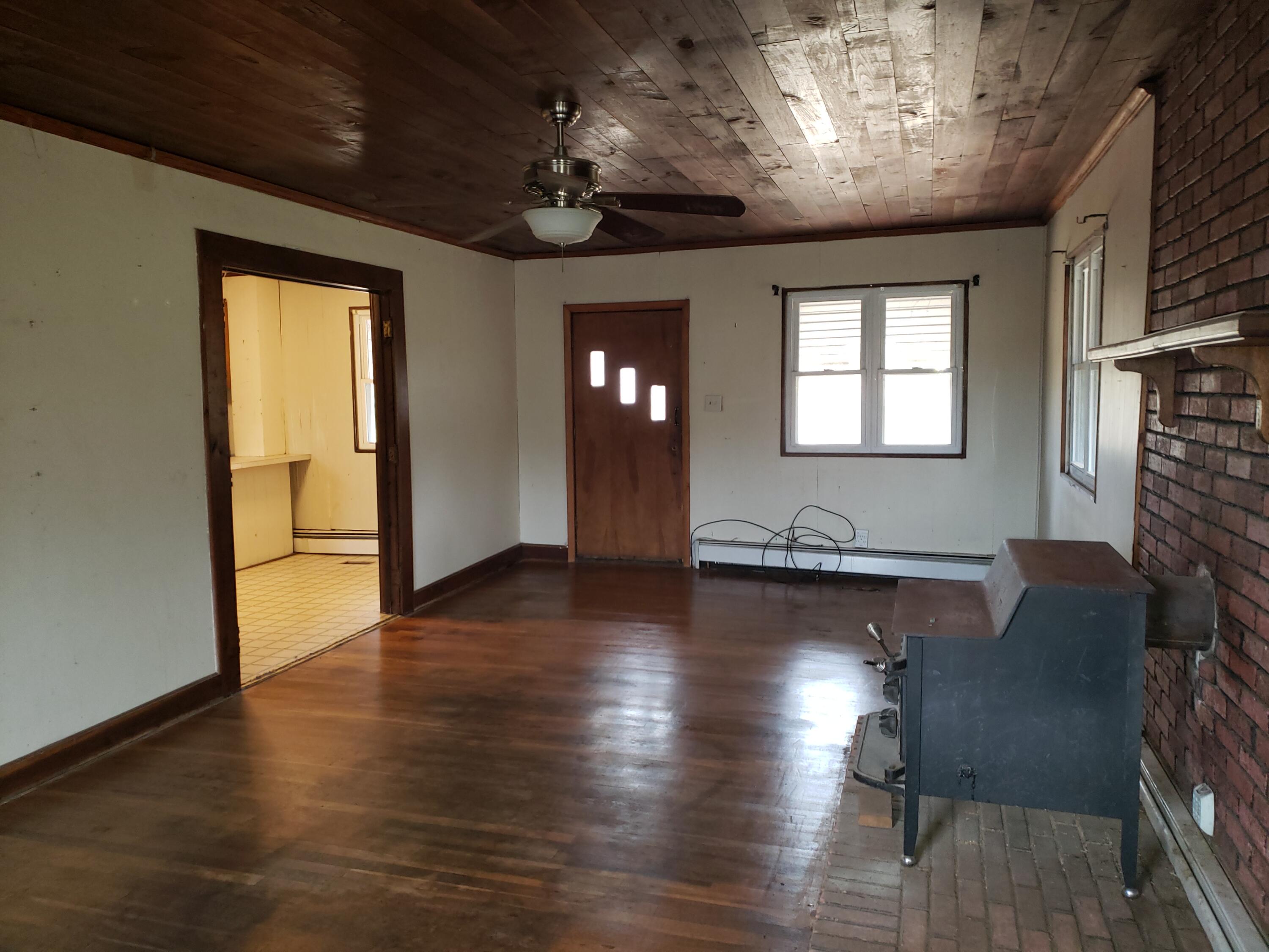 3400 Jae Valley Road Roanoke, VA 24014 - Photo 9 of 15 a view of a livingroom with furniture wooden floor and windows