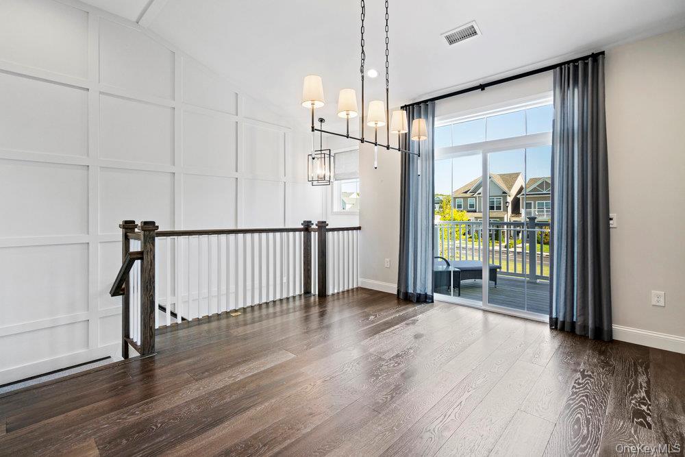 295 Silver Timber Drive Yaphank, NY 11980 - Photo 11 of 50 a view of entryway with wooden floor
