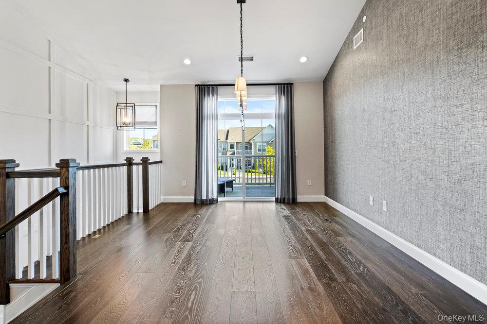 295 Silver Timber Drive Yaphank, NY 11980 - Photo 12 of 50 a view of entryway with wooden floor