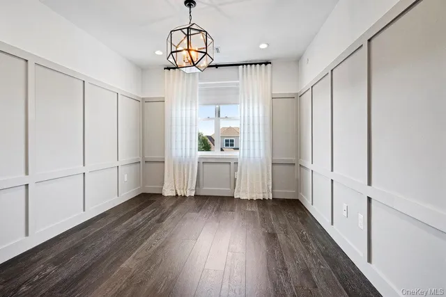 a view of kitchen with wooden floor and window