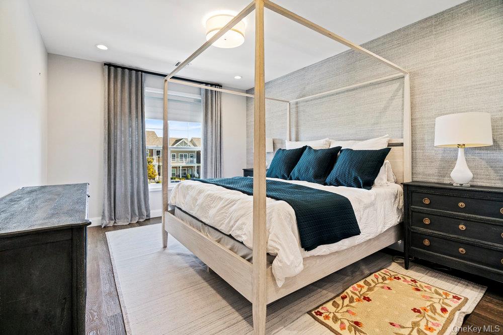 295 Silver Timber Drive Yaphank, NY 11980 - Photo 19 of 50 a bedroom with a bed and a window