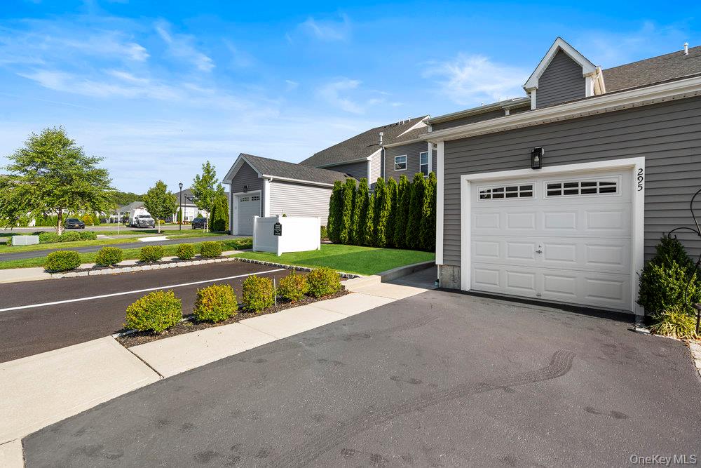 295 Silver Timber Drive Yaphank, NY 11980 - Photo 26 of 50 a view of a house with a yard