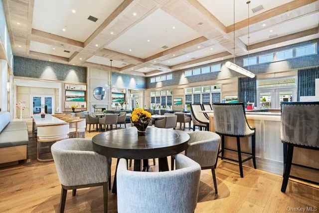 a living room with fireplace furniture and a large window