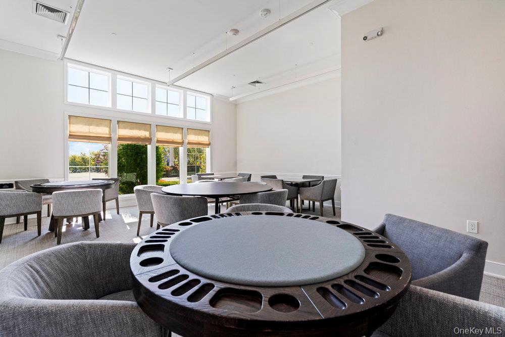295 Silver Timber Drive Yaphank, NY 11980 - Photo 33 of 50 a living room with furniture and a large window
