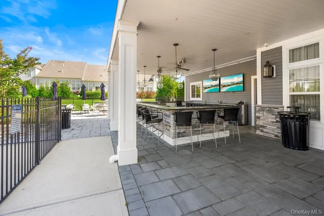 a living room with lots of furniture and a chandelier