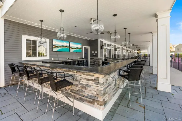a view of a patio with a table and chairs