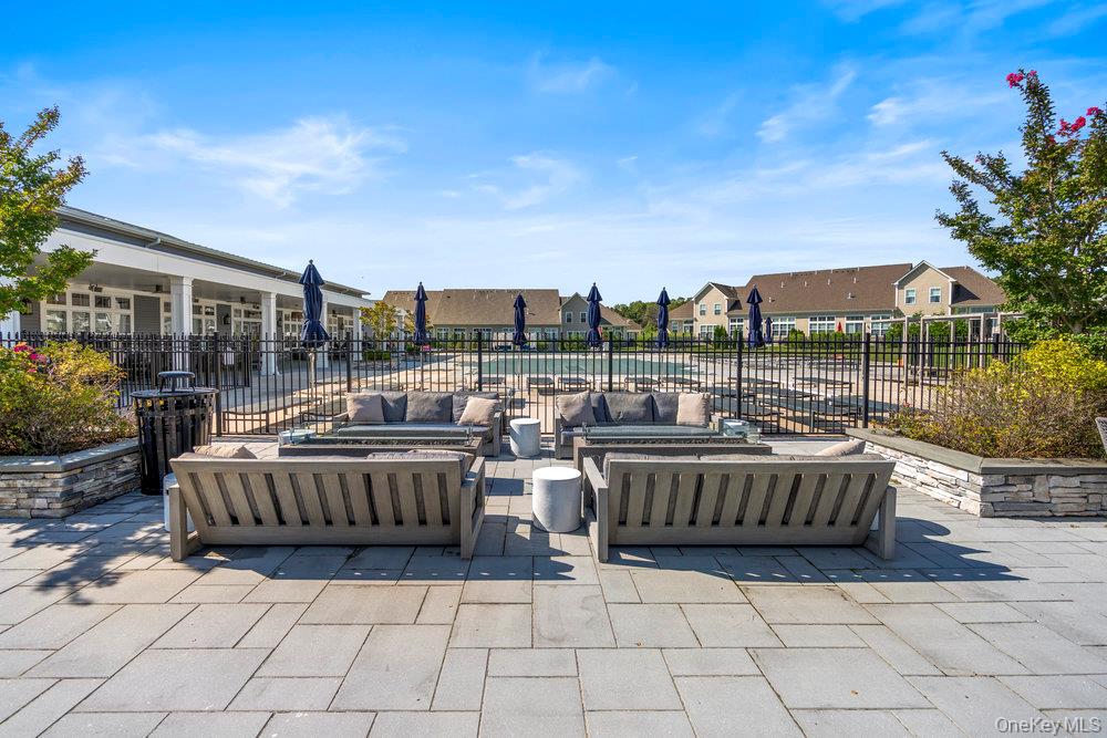 295 Silver Timber Drive Yaphank, NY 11980 - Photo 38 of 50 a living room with couch and a potted plant