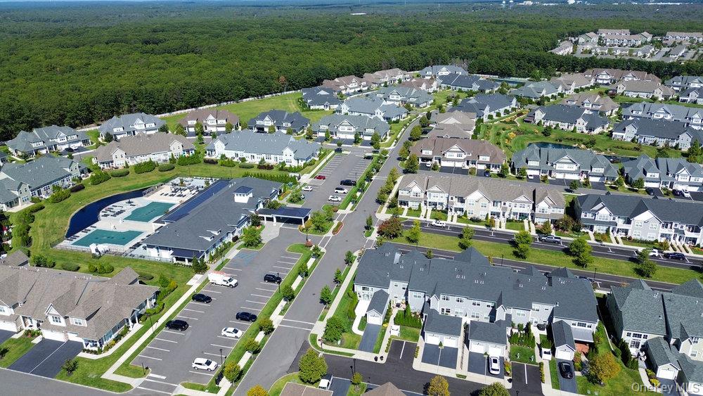 295 Silver Timber Drive Yaphank, NY 11980 - Photo 40 of 50 a city view with tall buildings