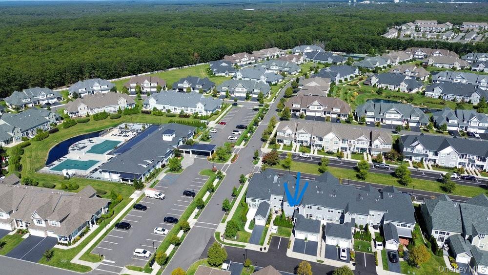 295 Silver Timber Drive Yaphank, NY 11980 - Photo 45 of 50 a city view with tall buildings