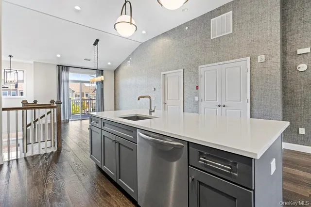 a kitchen with stove and cabinets