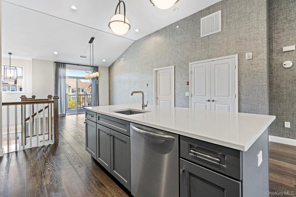 295 Silver Timber Drive Yaphank, NY 11980 - Photo 9 of 50 a kitchen with stove and cabinets