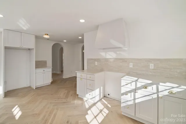 a view of a kitchen with furniture and a window