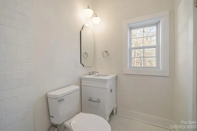 a bathroom with a shower toilet and sink