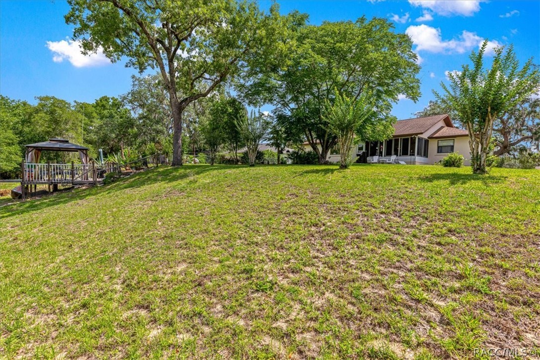 2964 South Cygnet Terrace Inverness, FL 34450 - Photo 49 of 67 a view of a house with a big yard