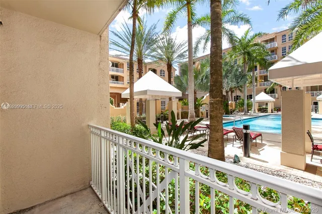 a view of a balcony with wooden floor