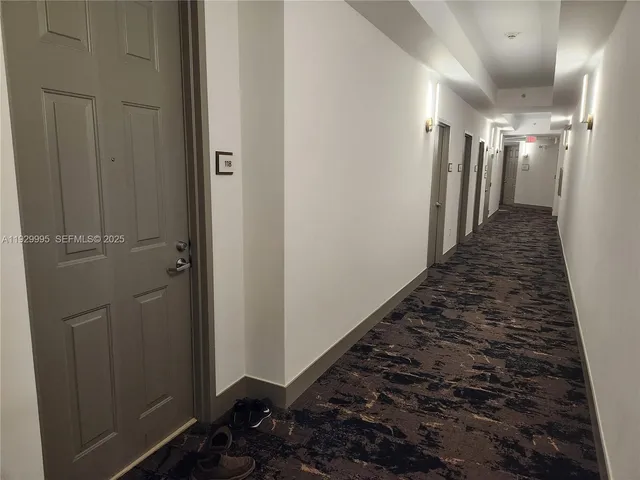 a view of a kitchen with a sink and cabinets