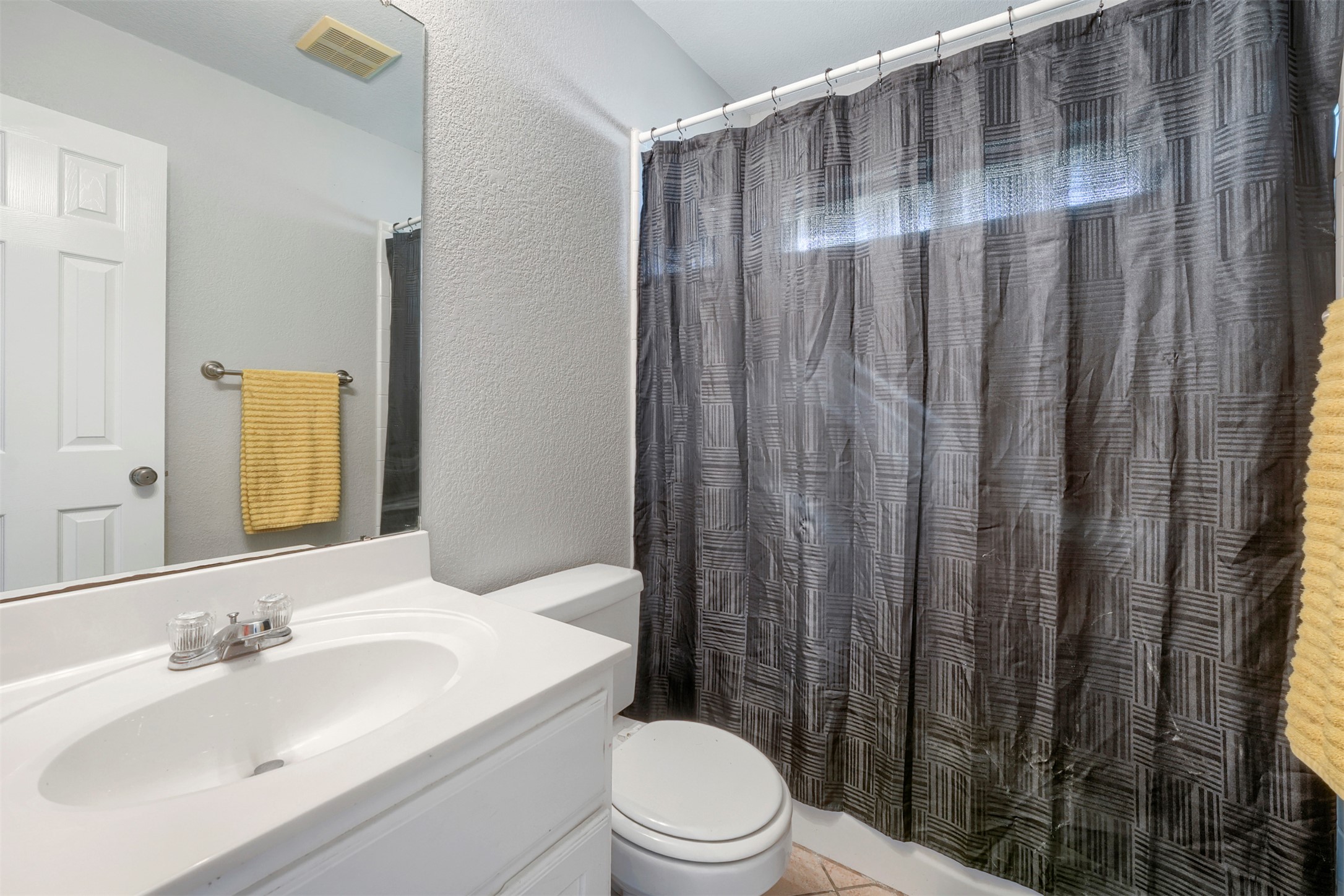 1105 2nd Street Jarrell, TX 76537 - Photo 19 of 27 Functional full bathroom featuring a crisp white vanity and a spacious shower.