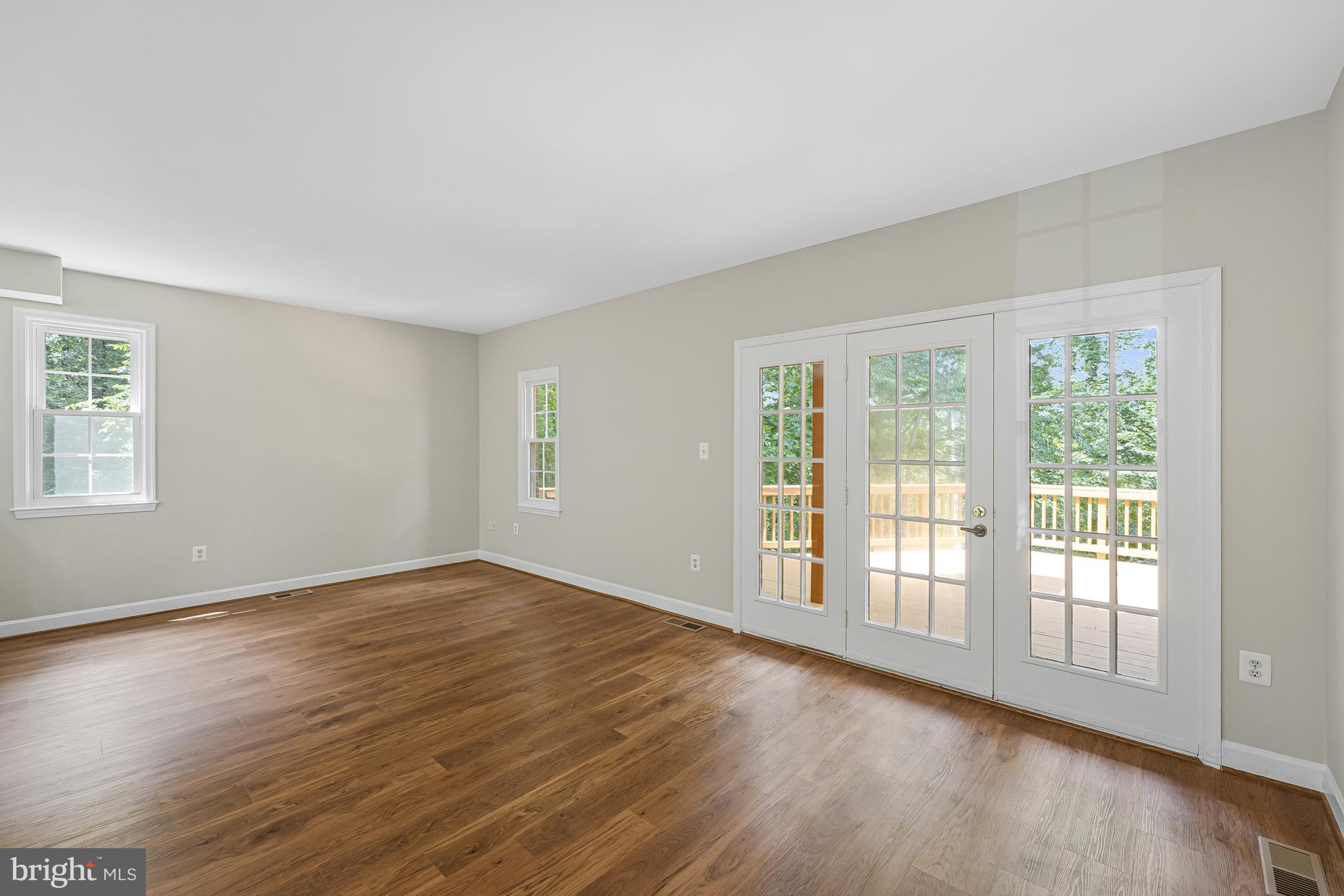 8530 Raglan Road Vienna, VA 22182 - Photo 13 of 59 Living room w/ french door to large deck