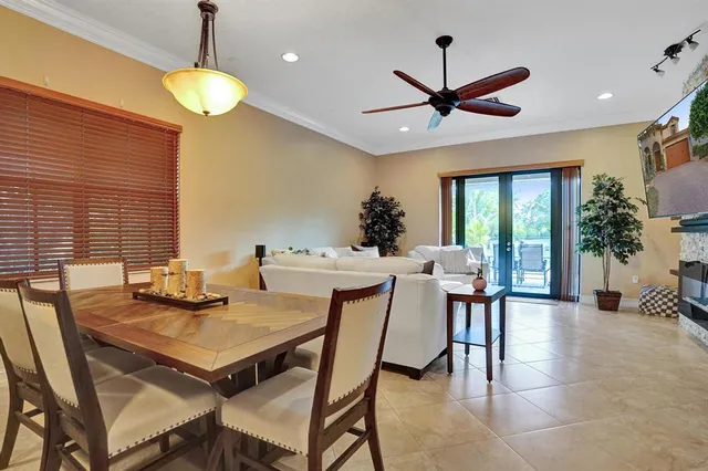 a kitchen with granite countertop a stove a sink and a refrigerator
