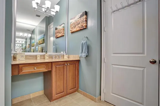 a view of a garden with plants and a bench