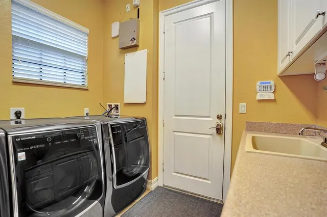 an aerial view of house with yard swimming pool and outdoor seating