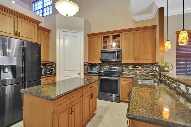 a view of a dining room with furniture and window