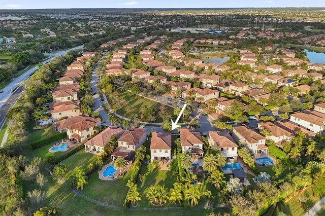 a view of a dining room with furniture a chandelier and wooden floor