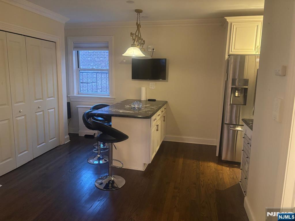 1495 Terrace Circle, Unit 6 Teaneck, NJ 07666 - Photo 13 of 16 a workspace with furniture and wooden floor