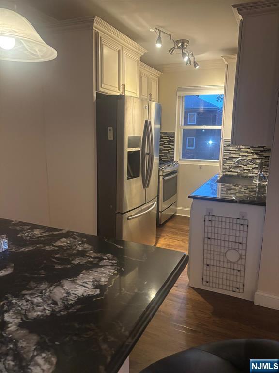 1495 Terrace Circle, Unit 6 Teaneck, NJ 07666 - Photo 8 of 16 a kitchen with stainless steel appliances granite countertop a refrigerator a stove and a sink