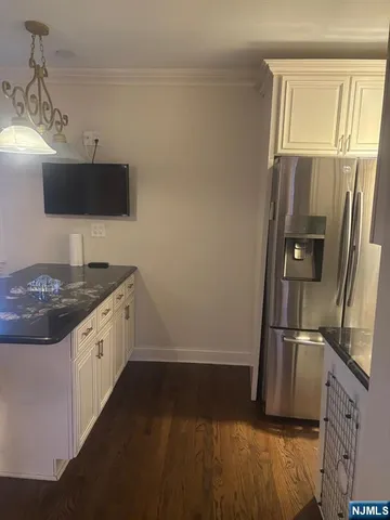 a kitchen with a sink and refrigerator