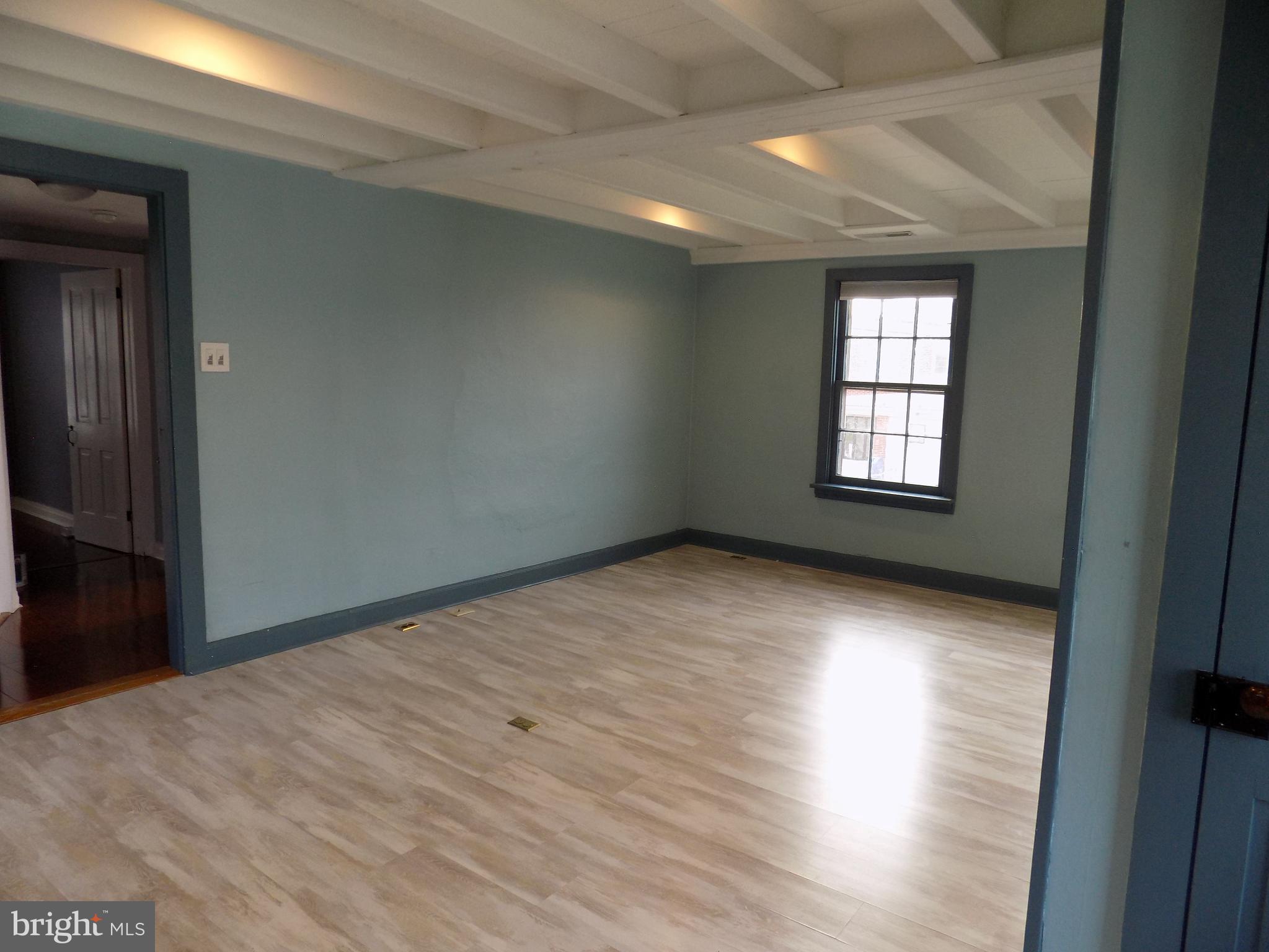 3103 Bedminster Road Ottsville, PA 18942 - Photo 12 of 22 an empty room with wooden floor and windows
