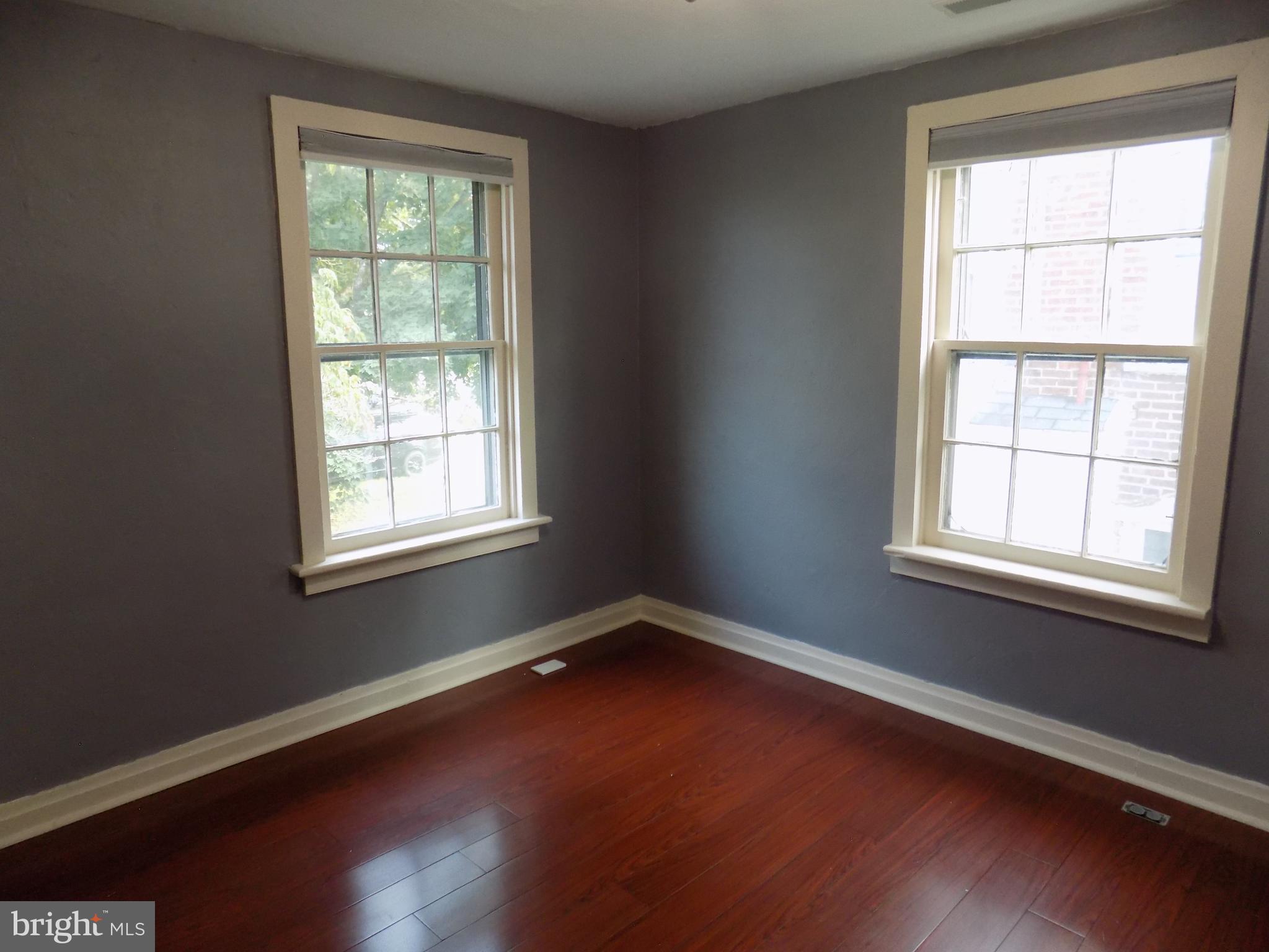 3103 Bedminster Road Ottsville, PA 18942 - Photo 16 of 22 an empty room with wooden floor and windows
