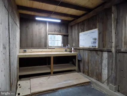 a view of room with a sink and a mirror
