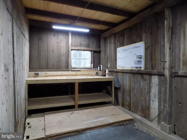 a view of room with a sink and a mirror