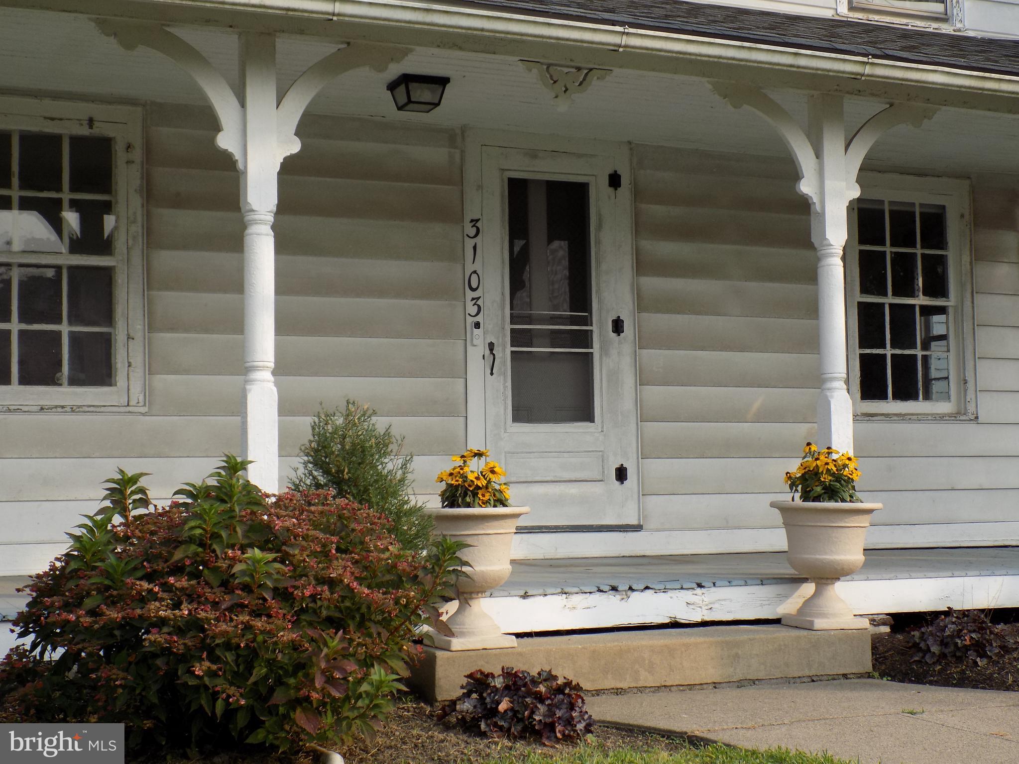 3103 Bedminster Road Ottsville, PA 18942 - Photo 2 of 22 a front view of a house with outdoor seating and plants