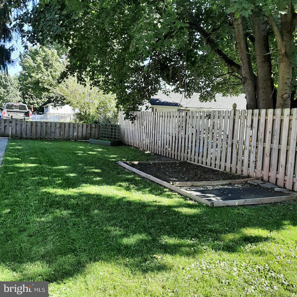 3103 Bedminster Road Ottsville, PA 18942 - Photo 5 of 22 a view of a backyard with a fence