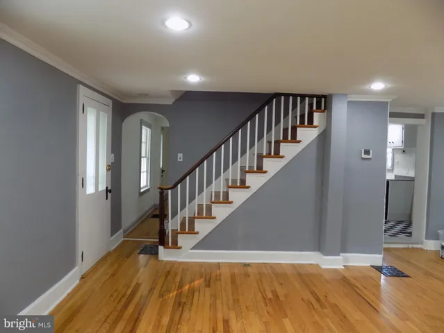 a view of entryway with wooden floor