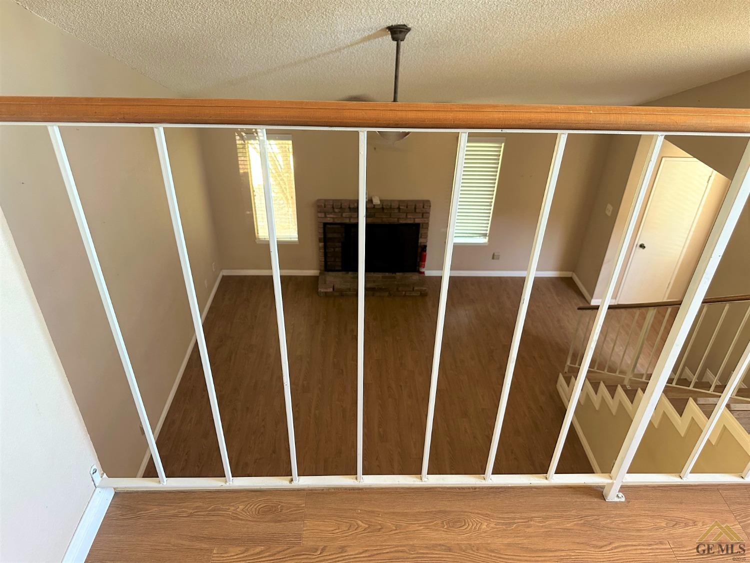 Undisclosed Address Bakersfield, CA 93313 - Photo 22 of 30 a view of walk in closet with wooden floor