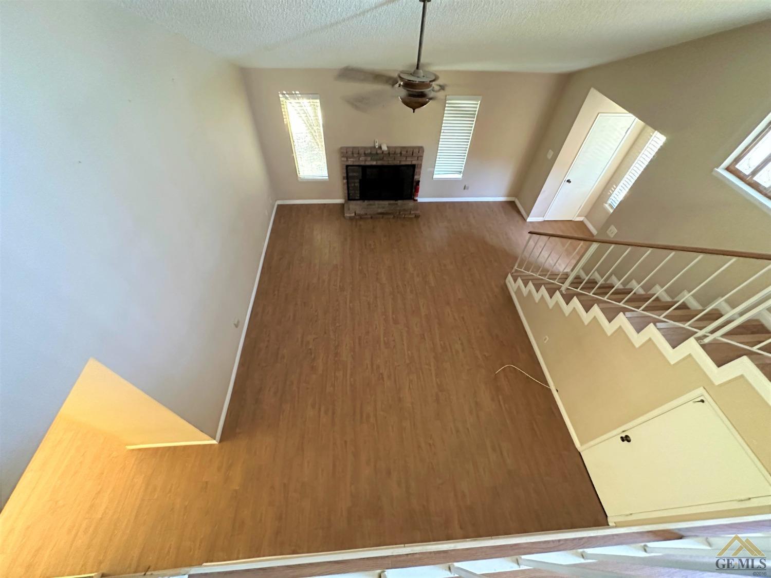 Undisclosed Address Bakersfield, CA 93313 - Photo 23 of 30 a view of a living room with a fireplace