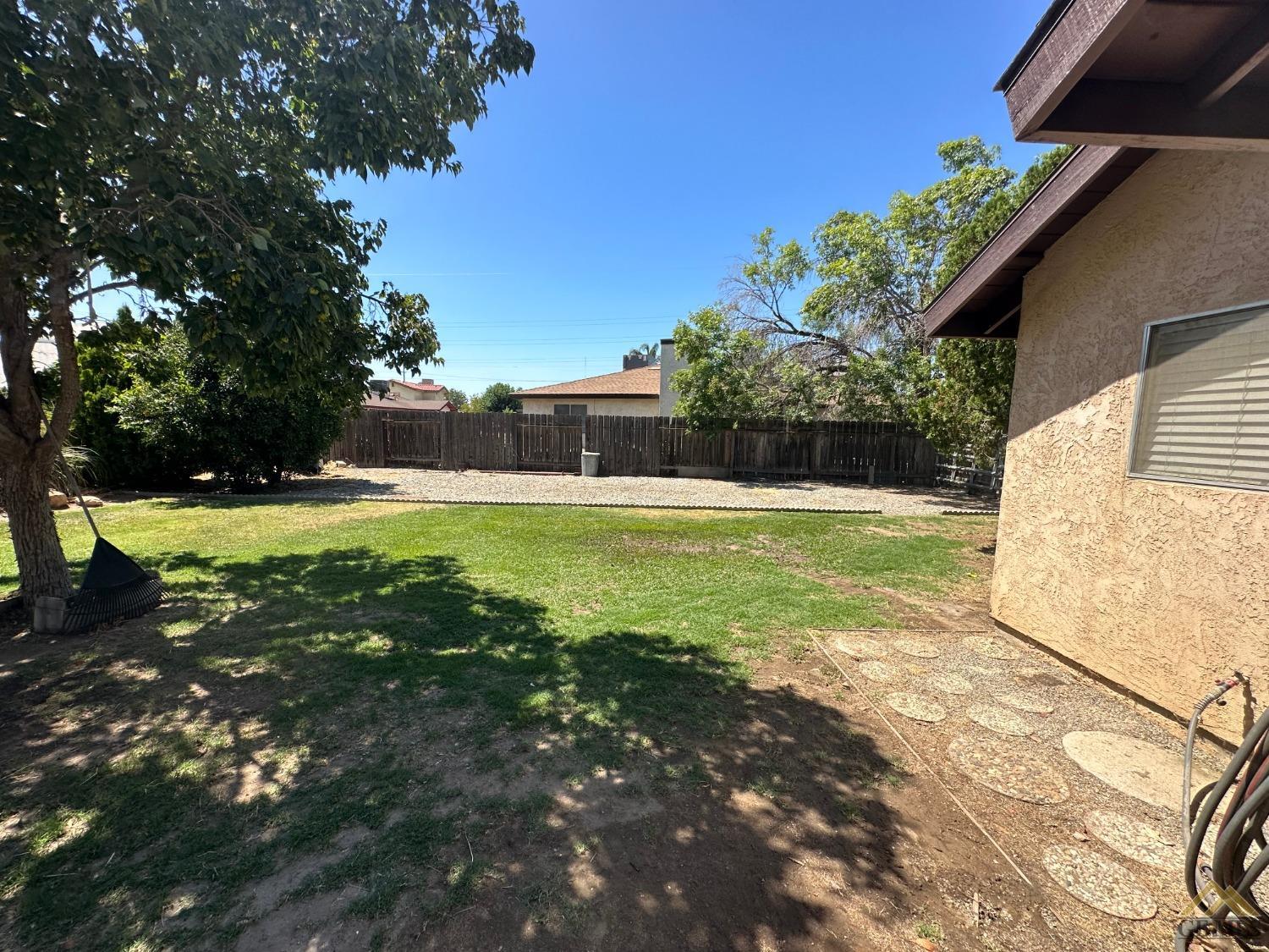 Undisclosed Address Bakersfield, CA 93313 - Photo 24 of 30 a view of a backyard with a garden