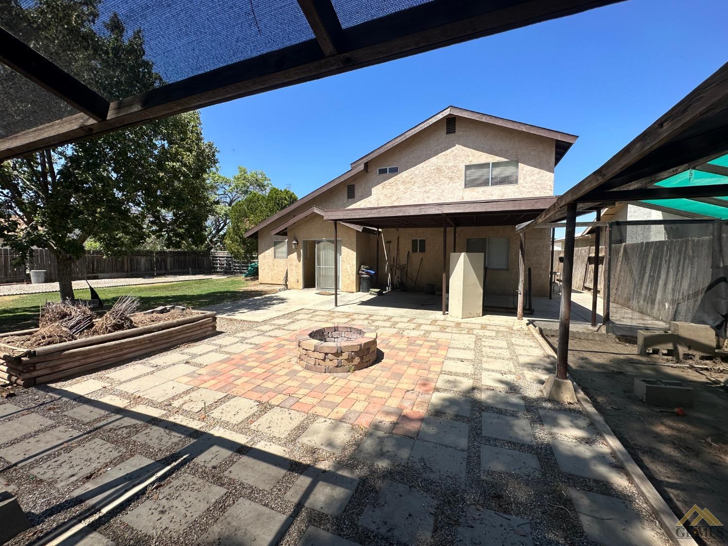 Undisclosed Address Bakersfield, CA 93313 - Photo 29 of 30 a view of a house with backyard and porch