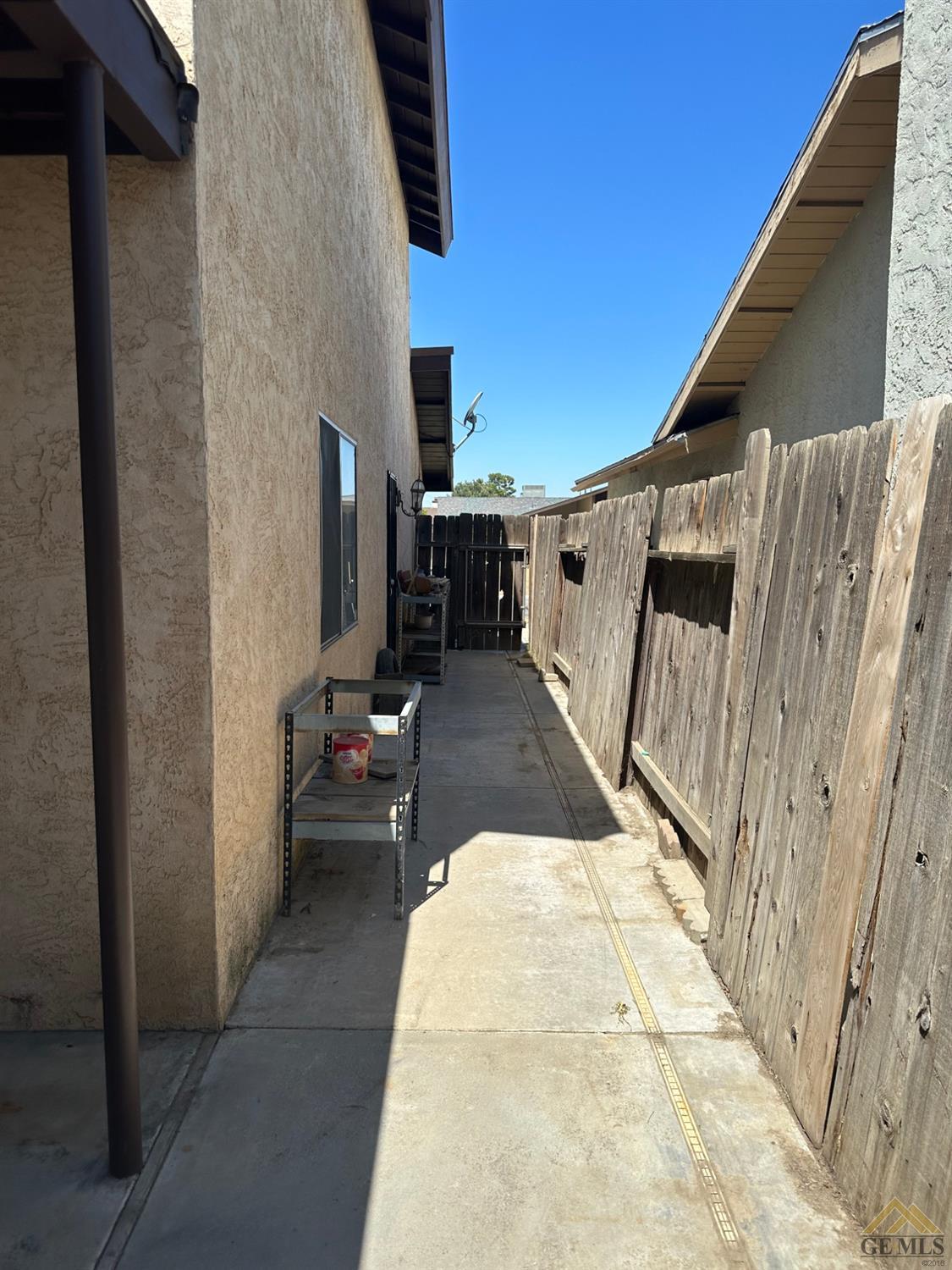 Undisclosed Address Bakersfield, CA 93313 - Photo 30 of 30 a view of a patio with table and chairs